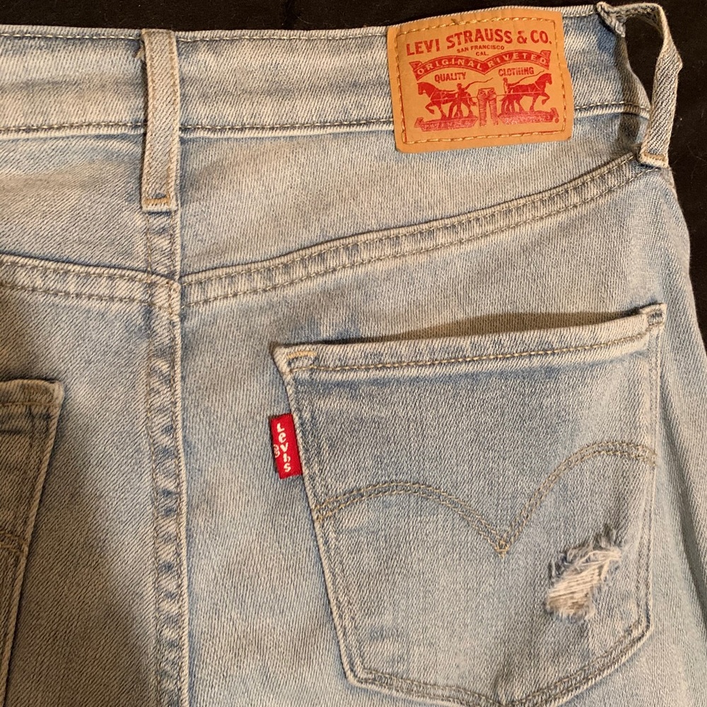 Levi’s 721 high rise skinny distressed jeans